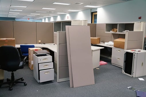 Used office furniture in a Houston, TX workspace, with cubicles and chairs.